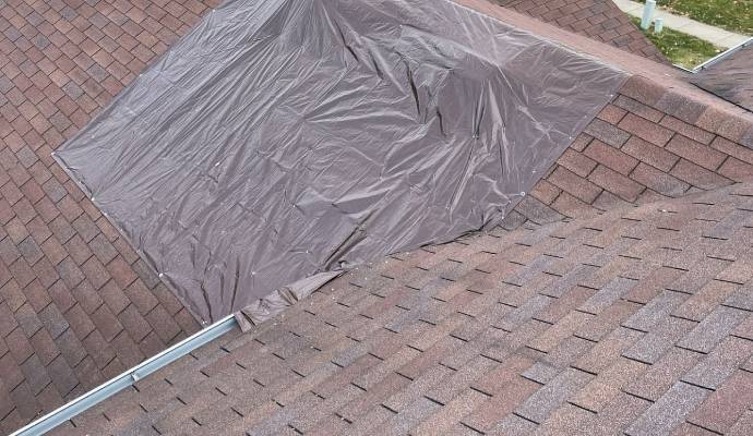 Tarp over the damage roof