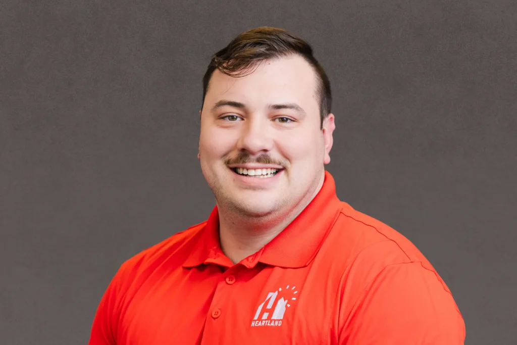 kellan coppinger headshot-heartland roofing-des moines