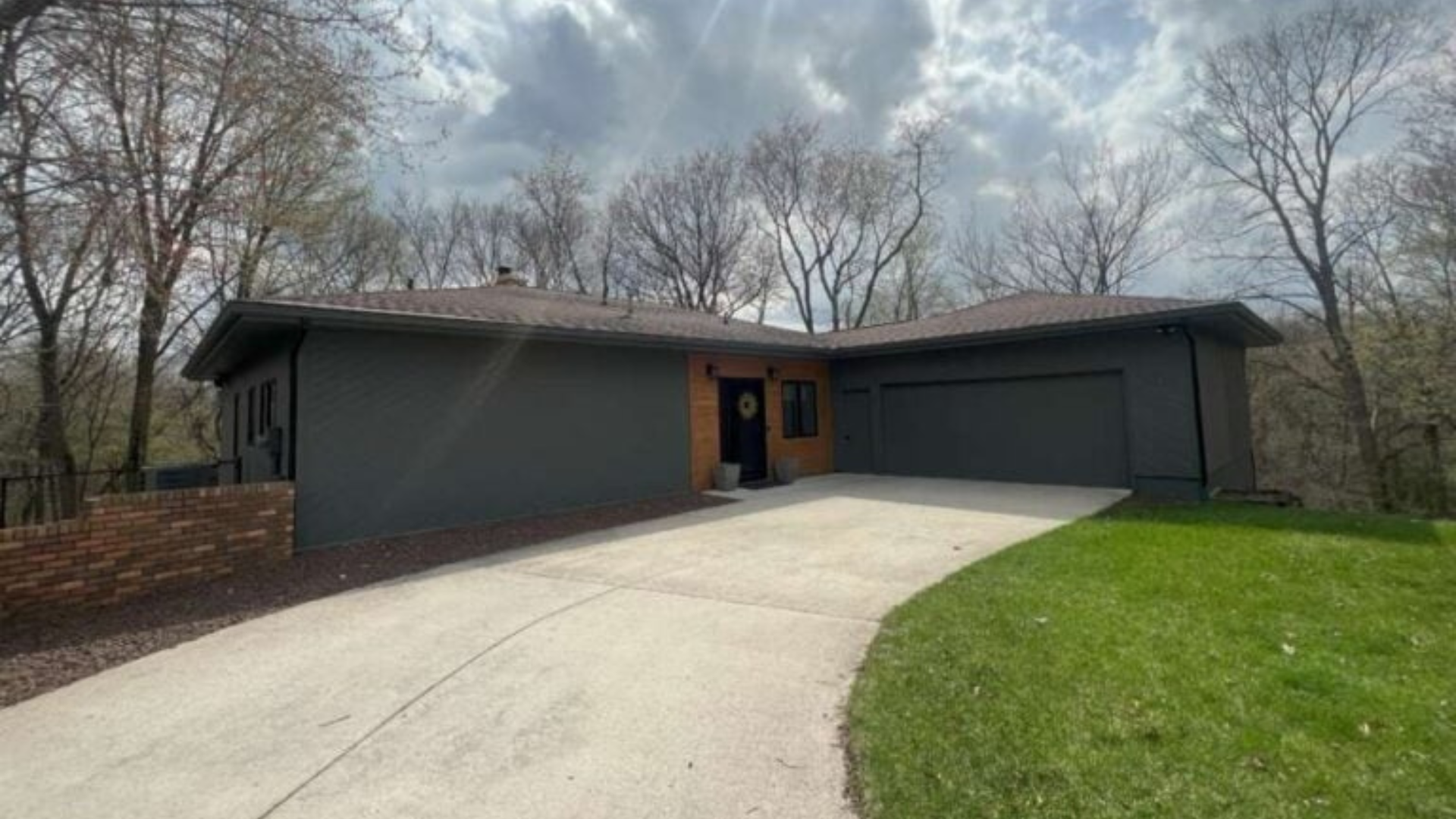 ﻿﻿A photo of a single-story home before a roofing replacement in Ames, Iowa.