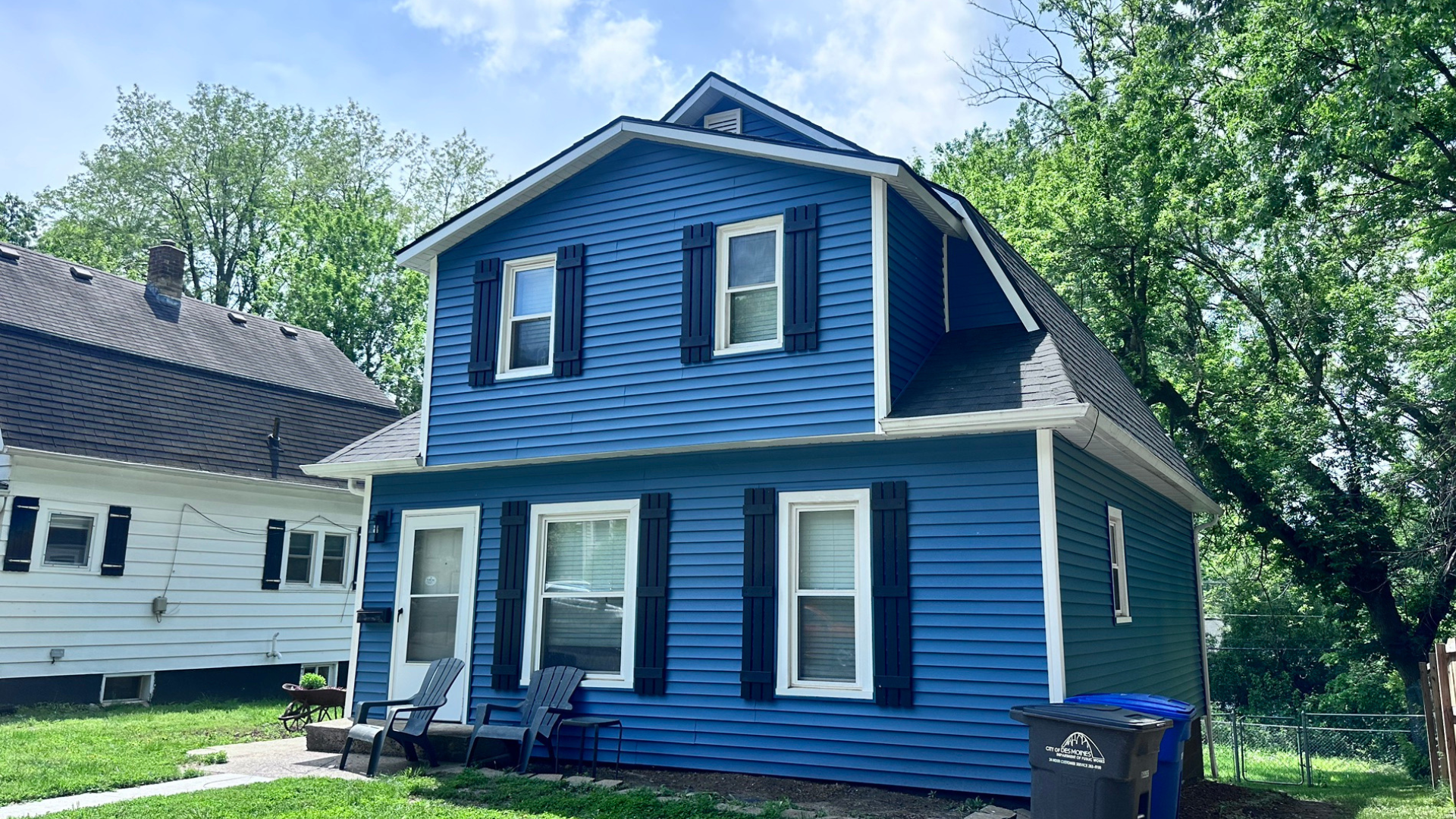 A siding replacement with Royal Estate siding in Heritage Blue with new fascia, soffit, and wraps in Des Moines, Iowa.