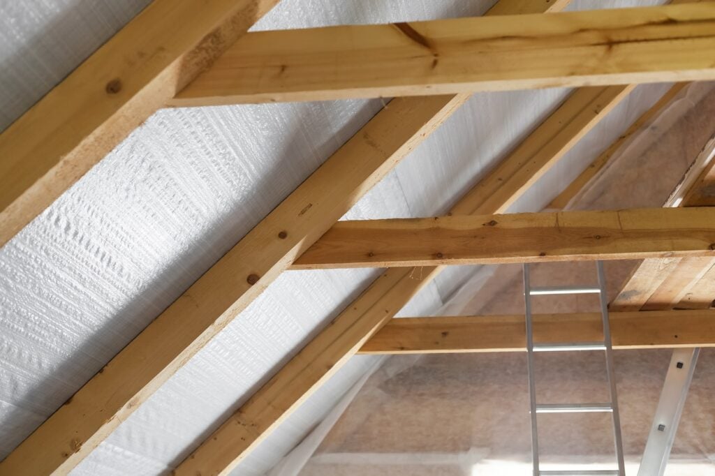 Inside wall insulation in wooden house,  building under construction
