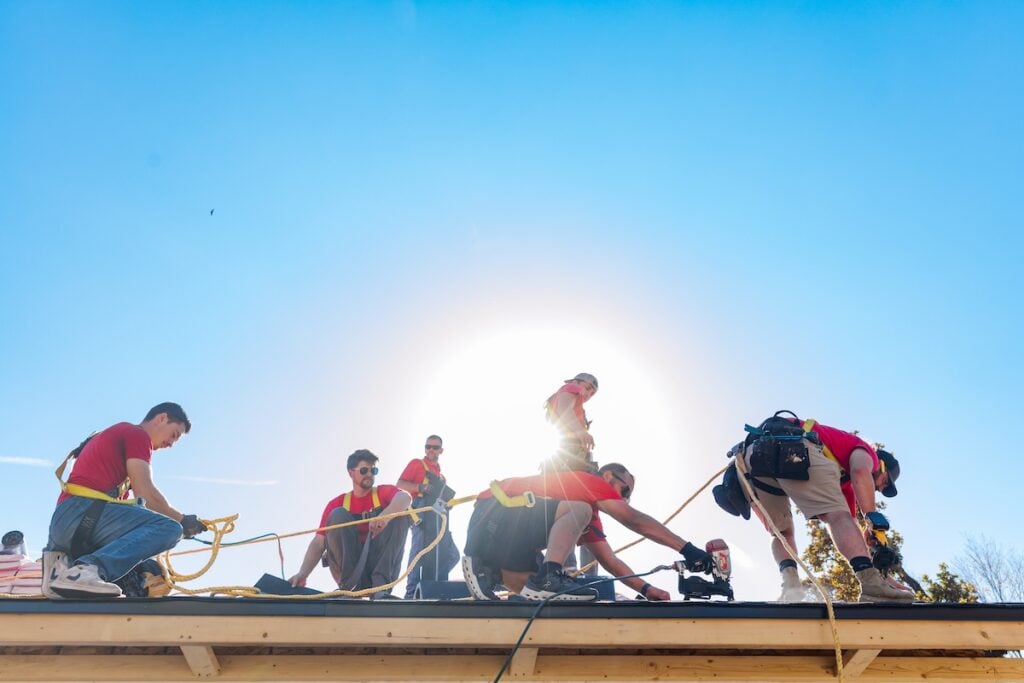 heartland team working on roof