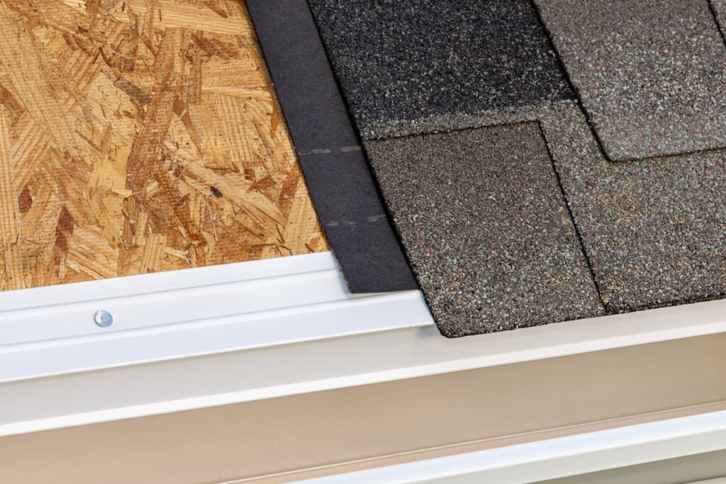 Cutaway view of house roof building materials.