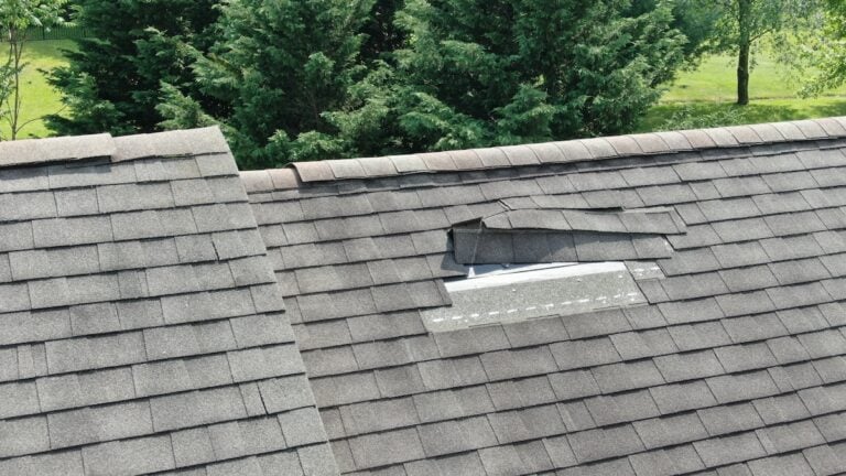 shingles lifted and missing from asphalt roof